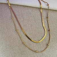 Collar doble con bolitas
